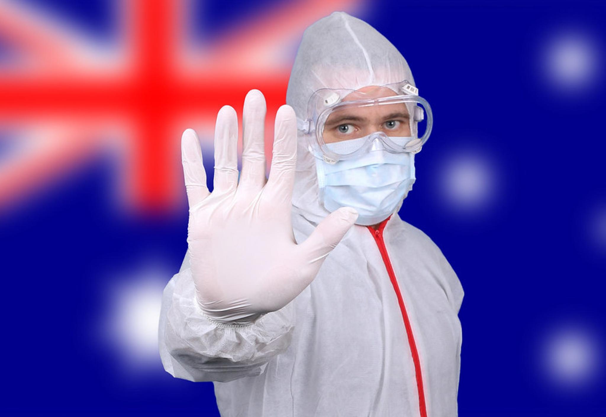 Worker in PPE with Australian flag background by Jernej Furman at https://flic.kr/p/2iNQNsV (CC BY 2.0)