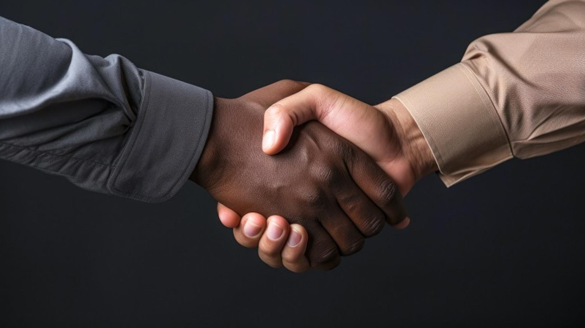 Image of dark and light skin tone hands in a handshake by vladyslav from https://stock.adobe.com/au/images/handshake-black-and-white-hand-no-racism-caucasian-human-interracial-concept-on-the-black-background-isolated/642151369 used under Education License